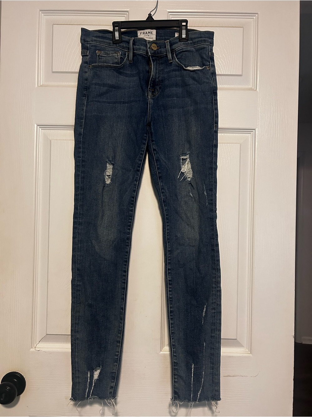 Frame Denim Skinny Jeans in Dark Blue with Distressed Details